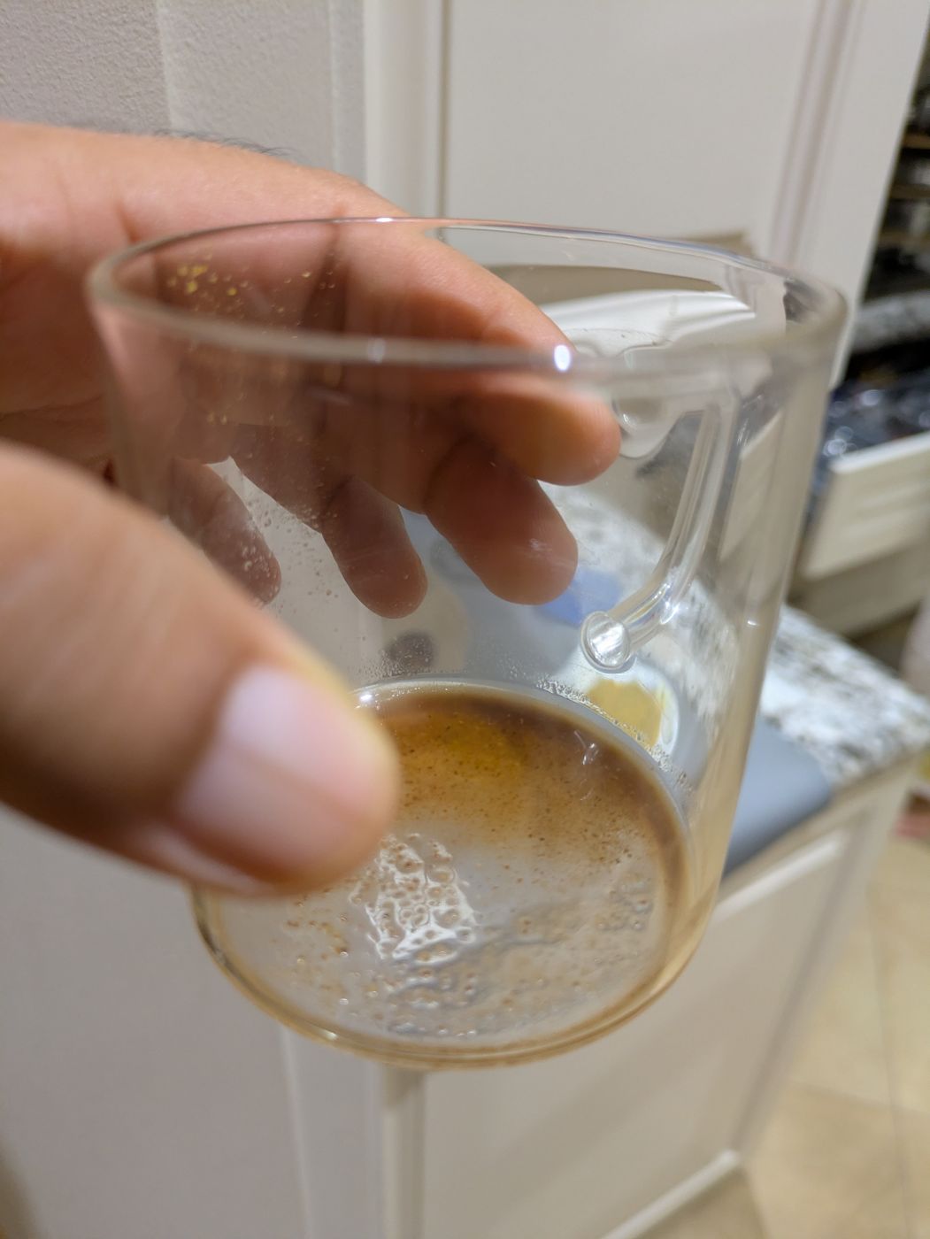 A hand holding an evening cup of Kisse